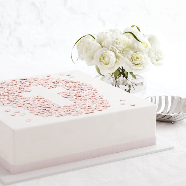 Bolo Cruz com florzinhas rosa